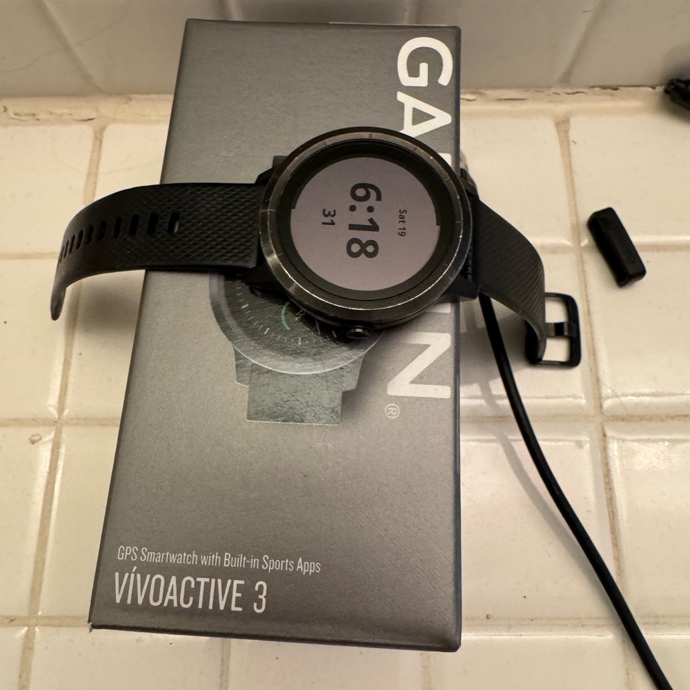 Garmin Black Smartwatch with Circular Display and Silicone Strap